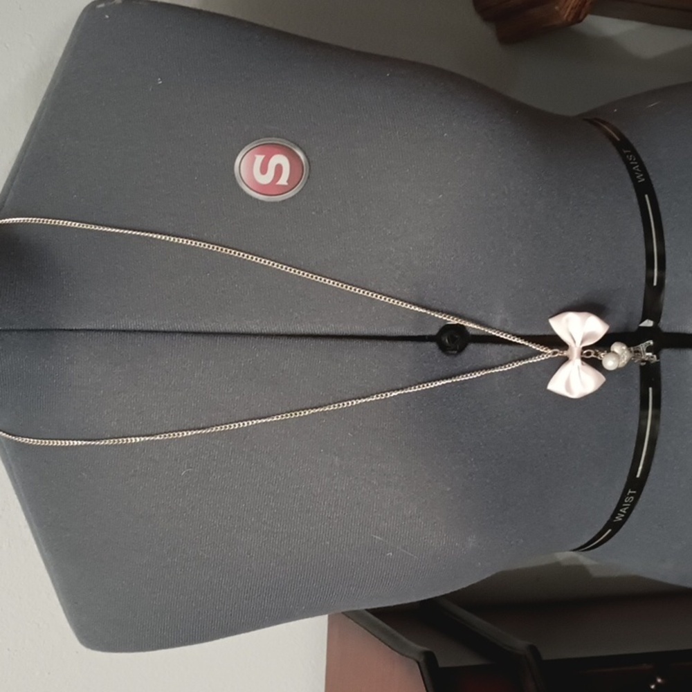 Long silver tone Eiffel tower pink bow necklace